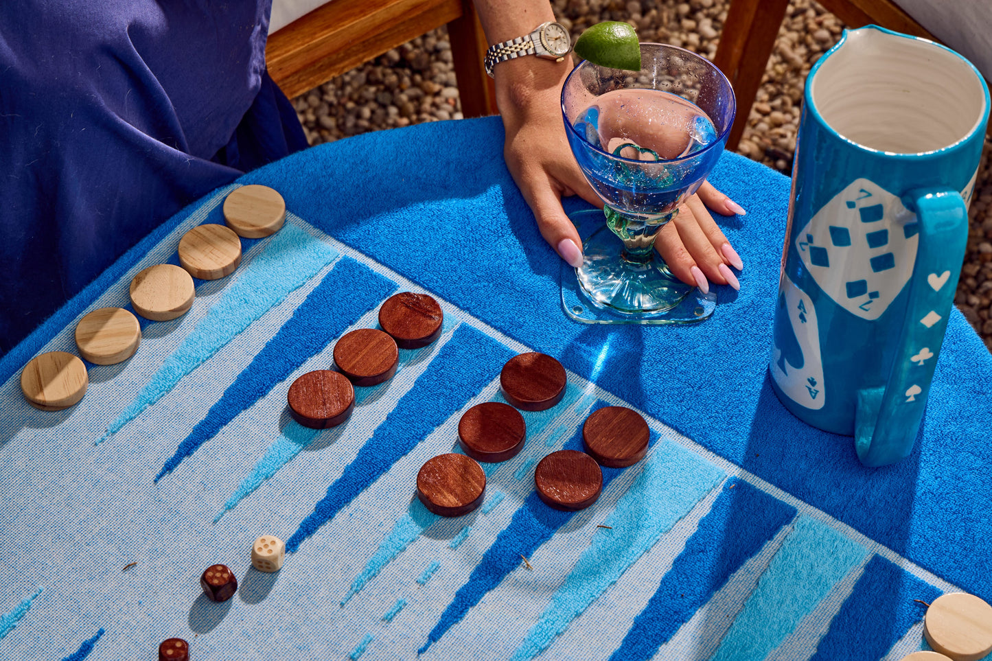 Girls playing backgammon on the beach board